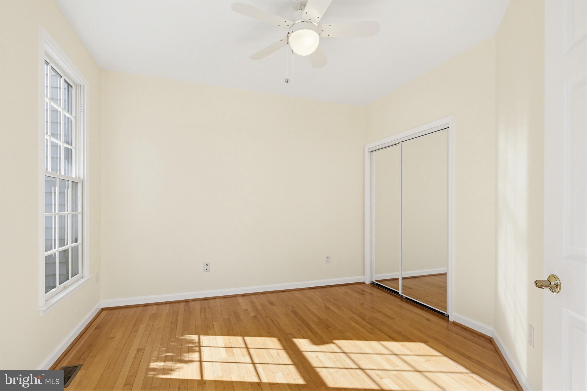 12017 Floating Clouds Path Clarksville, MD 21029 - Photo 25 of 54 a view of empty room with wooden floor and fan