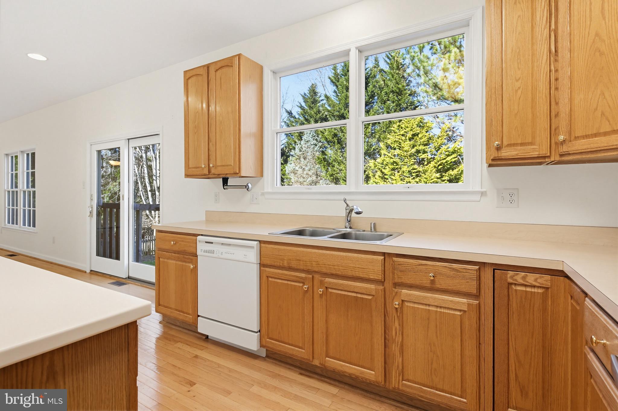12017 Floating Clouds Path Clarksville, MD 21029 - Photo 27 of 54 a kitchen with sink and large window