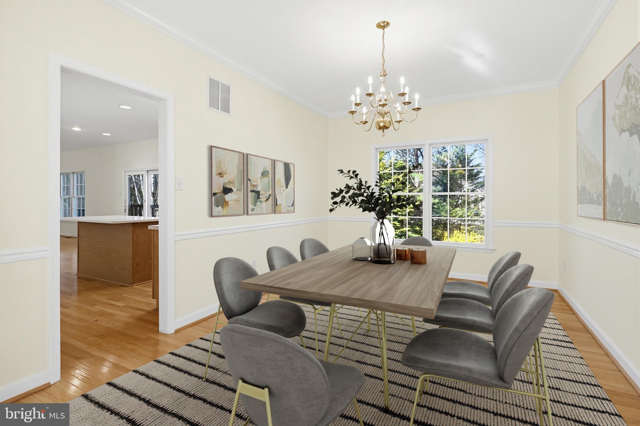 12017 Floating Clouds Path Clarksville, MD 21029 - Photo 4 of 54 a view of a dining room with furniture and a chandelier