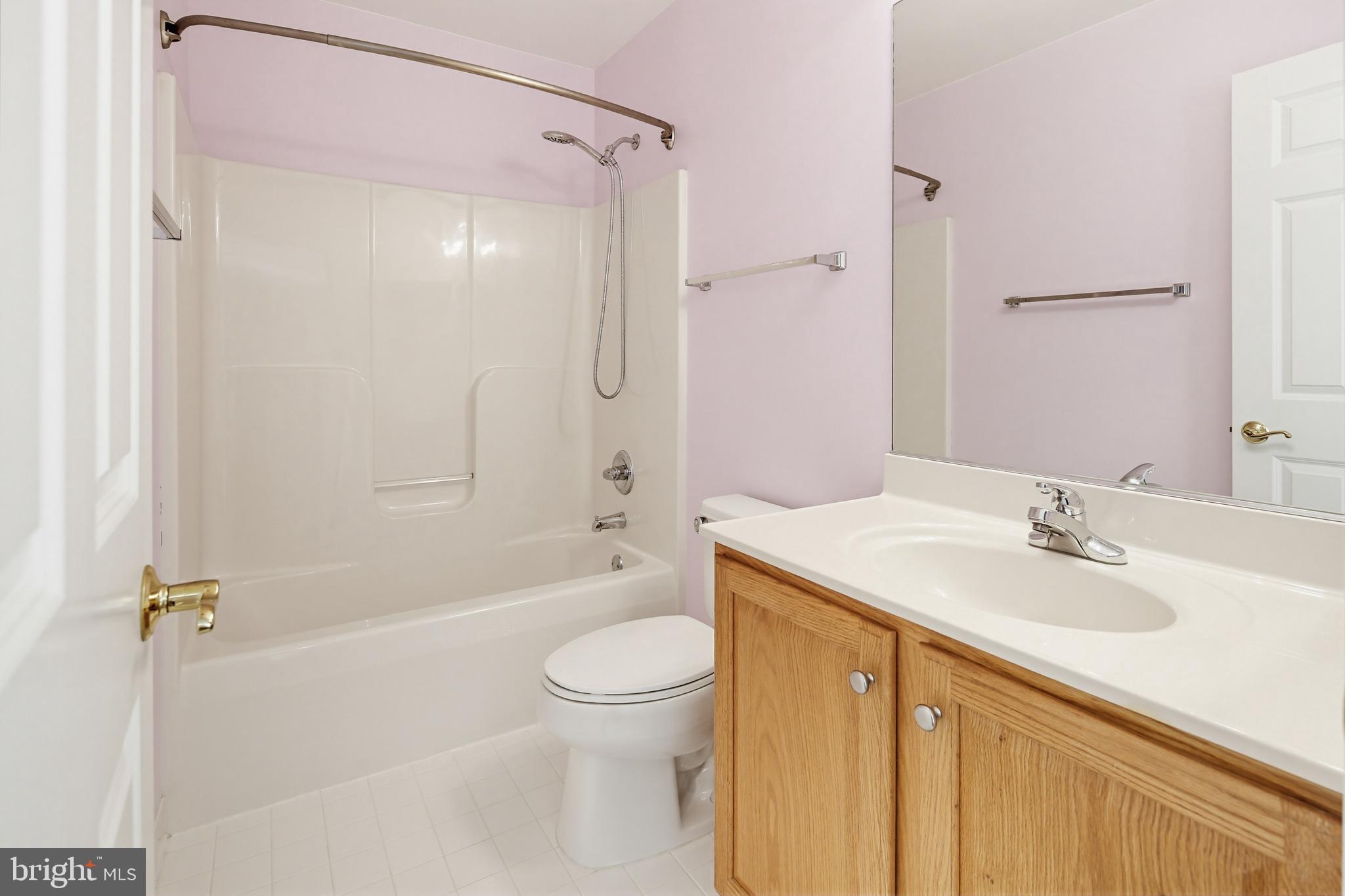 12017 Floating Clouds Path Clarksville, MD 21029 - Photo 43 of 54 a bathroom with a sink a toilet and shower