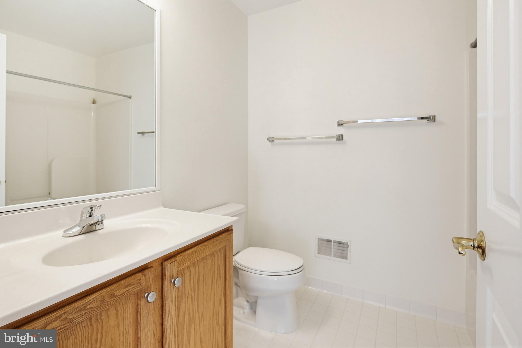12017 Floating Clouds Path Clarksville, MD 21029 - Photo 44 of 54 a bathroom with a sink toilet and vanity