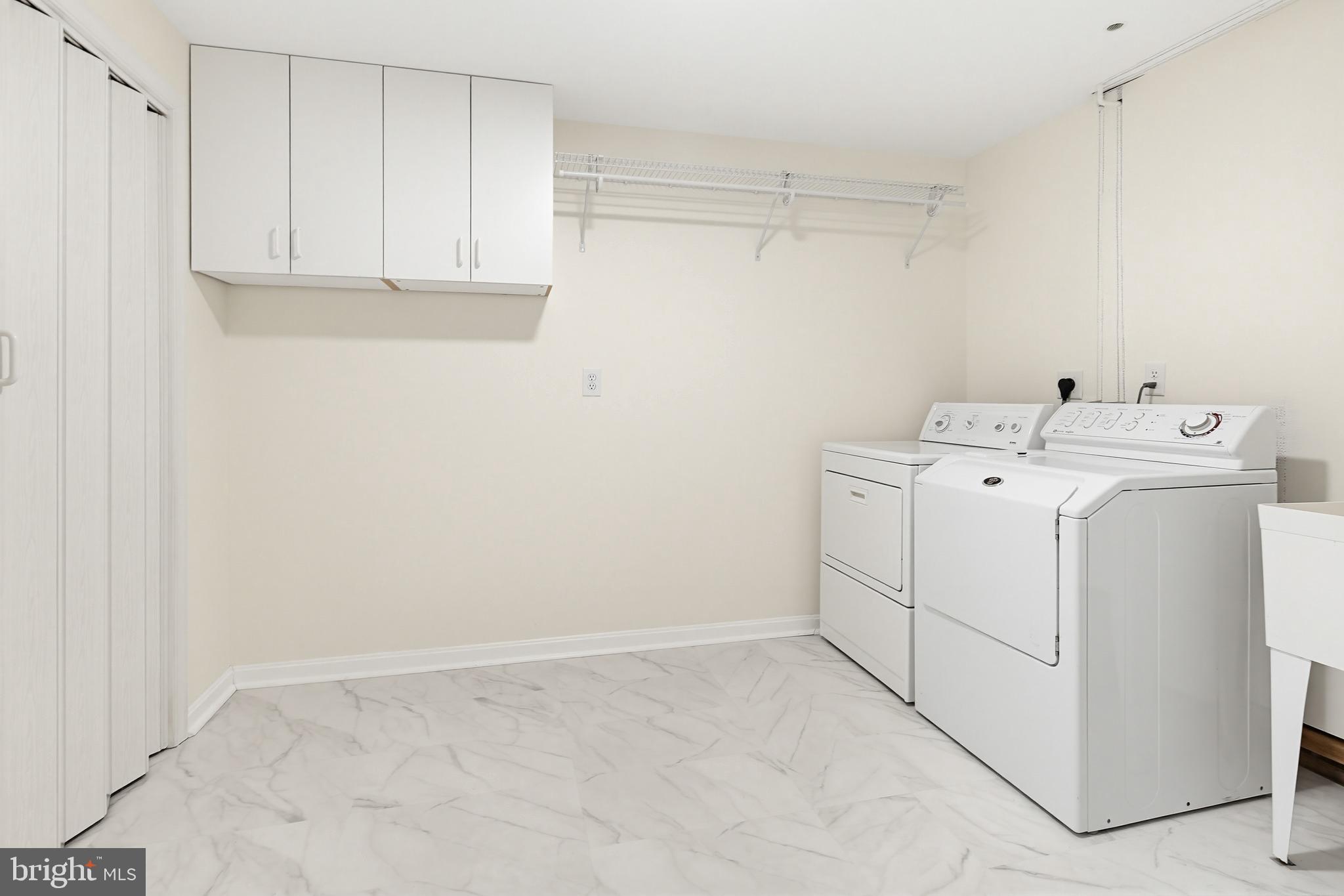12017 Floating Clouds Path Clarksville, MD 21029 - Photo 49 of 54 a utility room with dryer and washer