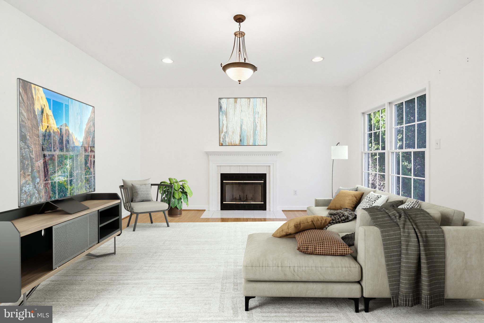 12017 Floating Clouds Path Clarksville, MD 21029 - Photo 7 of 54 a living room with furniture a window and a fireplace