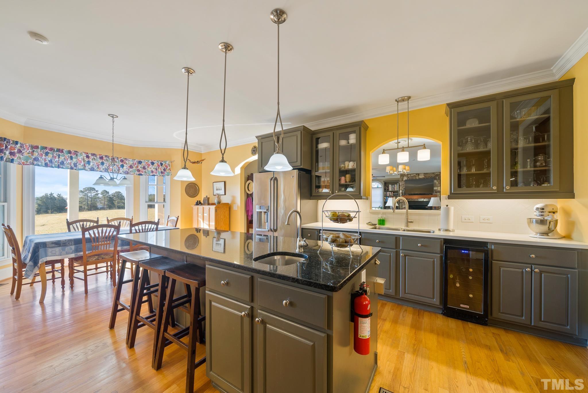1616 Carl Durham Road Chapel Hill, NC 27516 - Photo 11 of 56 a kitchen with a large window and dining table