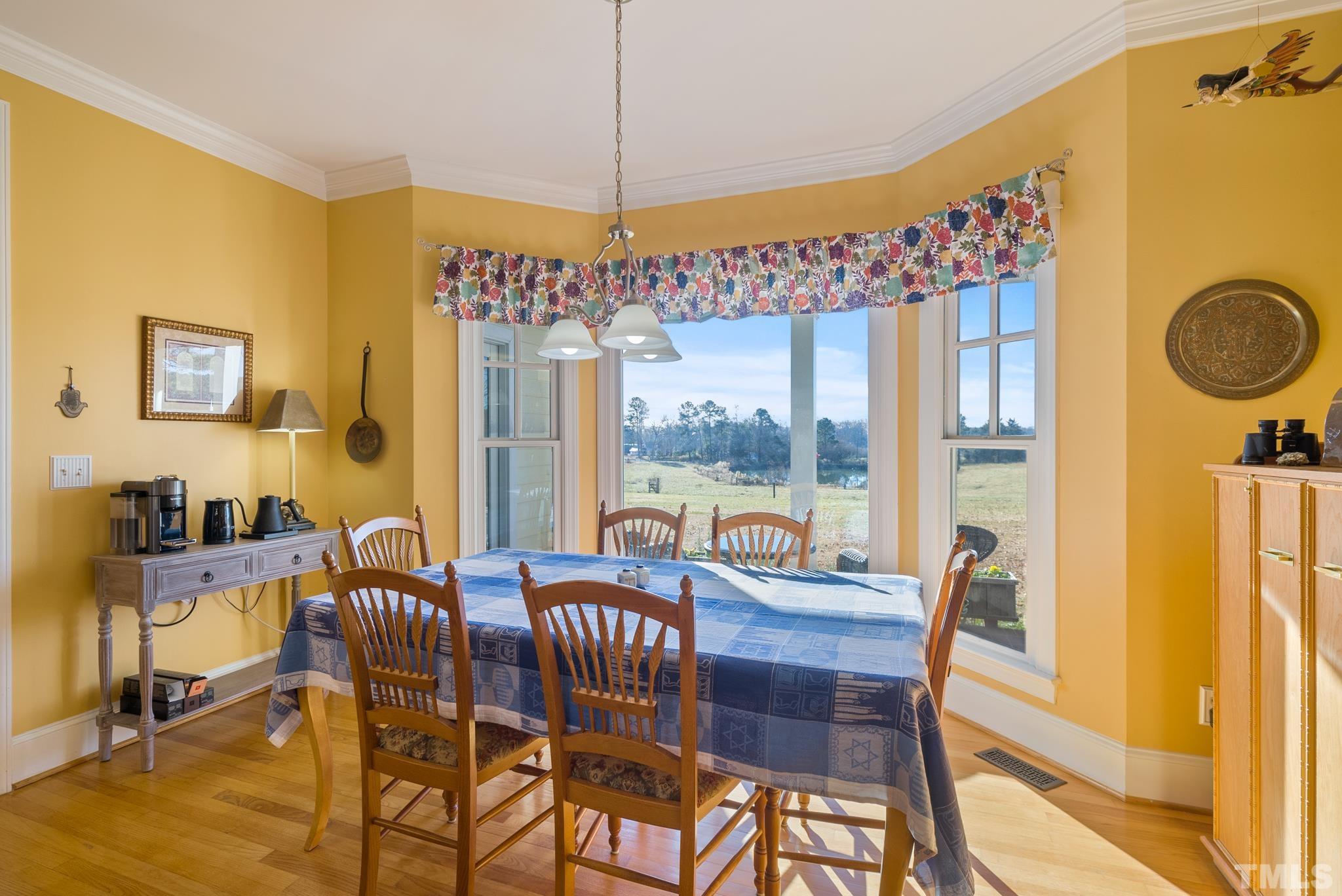 1616 Carl Durham Road Chapel Hill, NC 27516 - Photo 12 of 56 a view of a dining room with furniture window and outside view