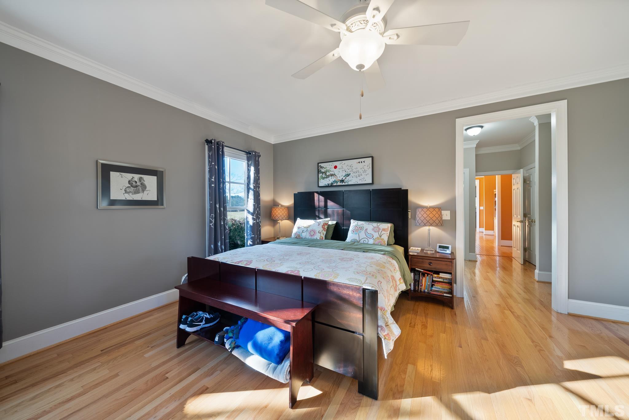 1616 Carl Durham Road Chapel Hill, NC 27516 - Photo 16 of 56 a bedroom with a bed and wooden floor