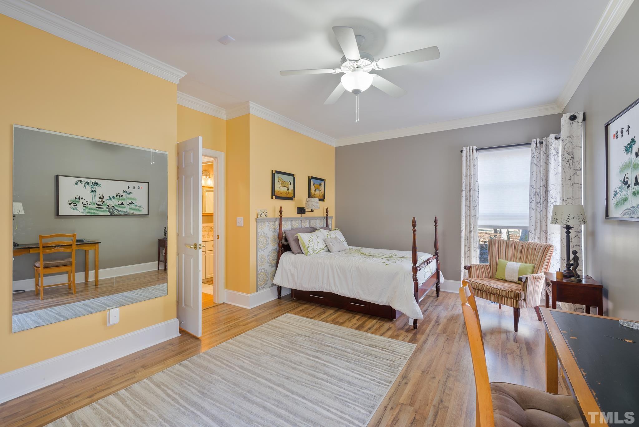 1616 Carl Durham Road Chapel Hill, NC 27516 - Photo 20 of 56 a living room with furniture and a chandelier
