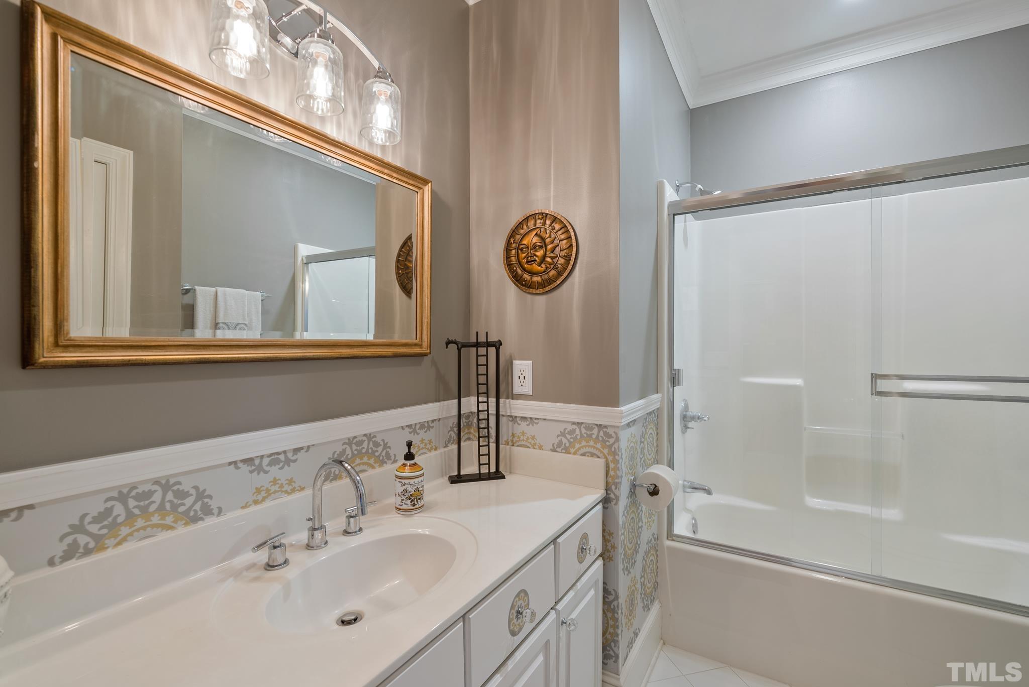 1616 Carl Durham Road Chapel Hill, NC 27516 - Photo 22 of 56 a bathroom with a sink a mirror and a bathtub