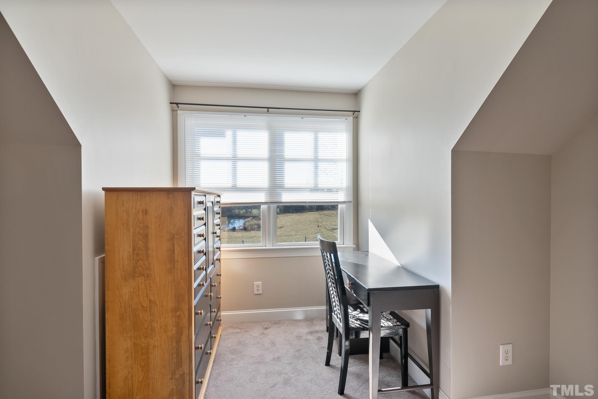 1616 Carl Durham Road Chapel Hill, NC 27516 - Photo 25 of 56 a room with furniture and a window