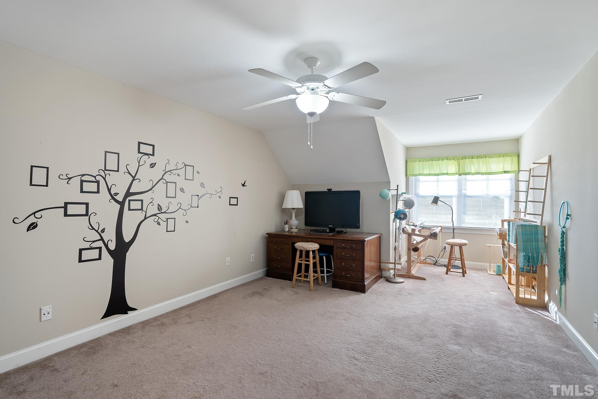 1616 Carl Durham Road Chapel Hill, NC 27516 - Photo 27 of 56 a view of a livingroom with workspace and a window
