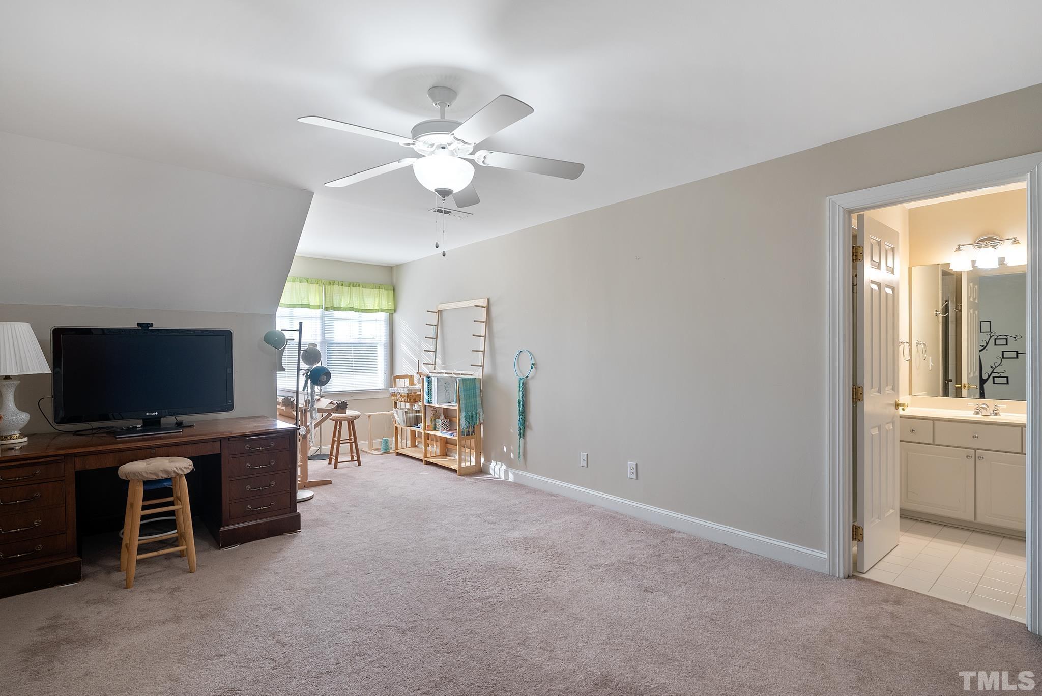 1616 Carl Durham Road Chapel Hill, NC 27516 - Photo 28 of 56 a view of a livingroom with furniture and a flat screen tv