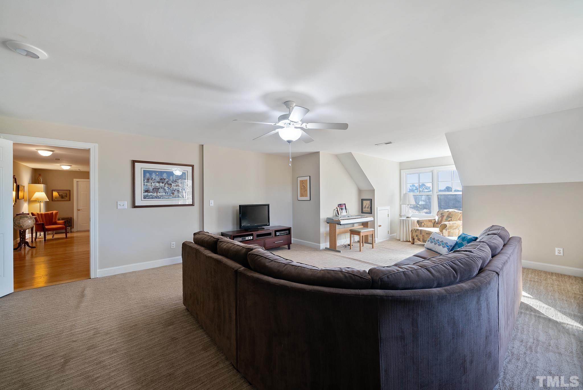 1616 Carl Durham Road Chapel Hill, NC 27516 - Photo 30 of 56 a living room with furniture and a table