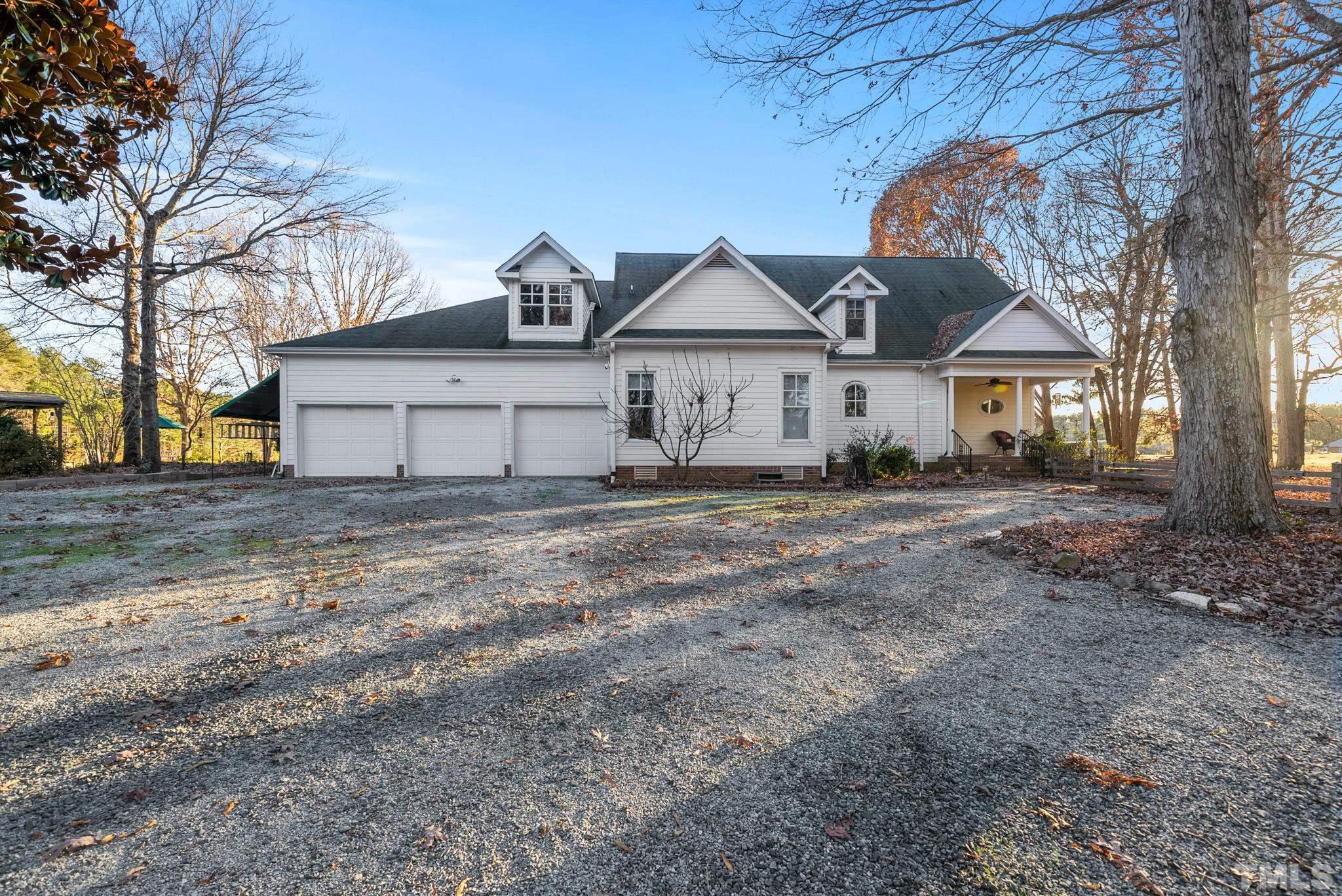 1616 Carl Durham Road Chapel Hill, NC 27516 - Photo 36 of 56 a view of a house with a yard