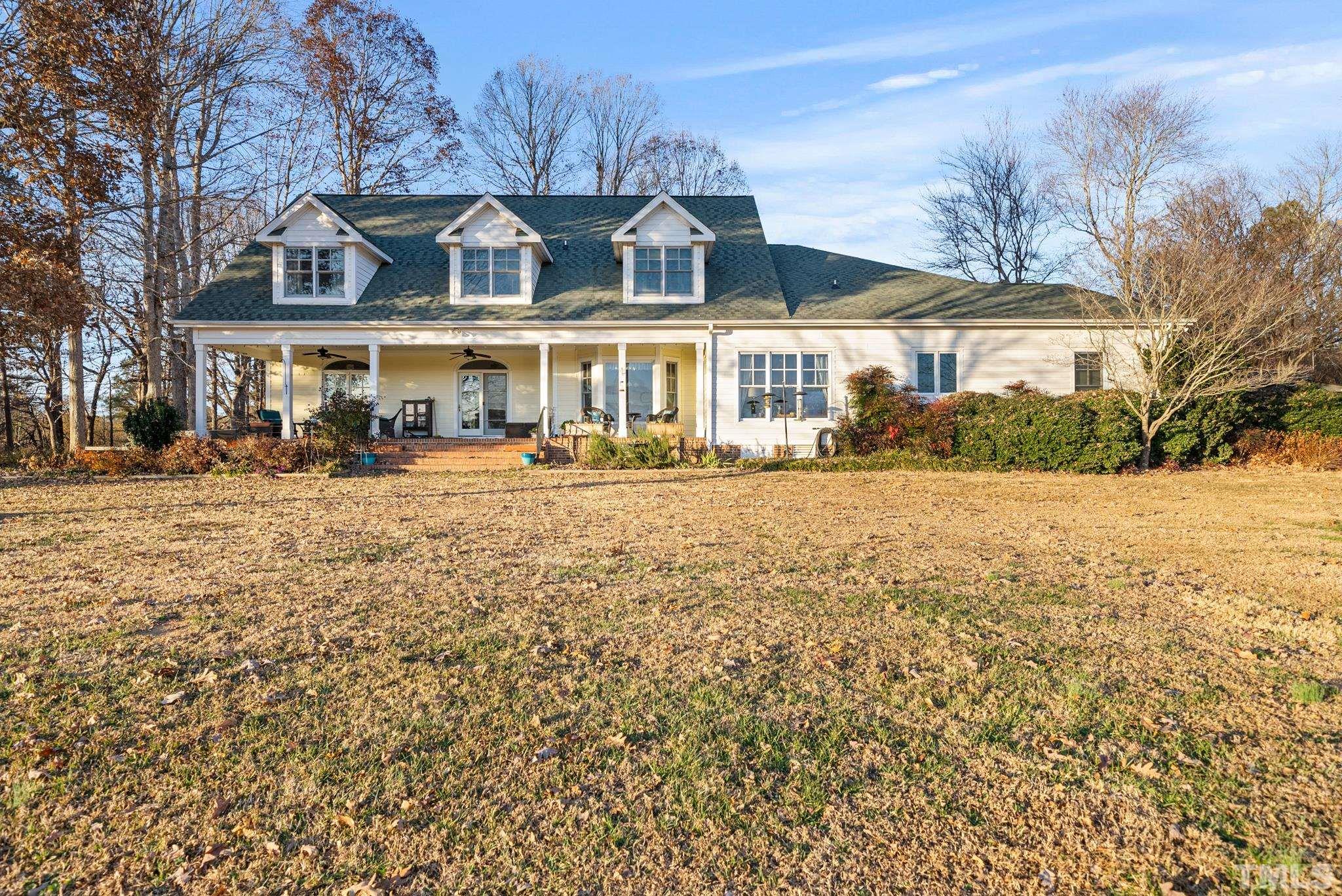 1616 Carl Durham Road Chapel Hill, NC 27516 - Photo 44 of 56 a front view of a house with a yard