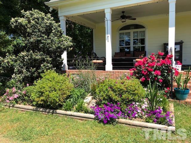 1616 Carl Durham Road Chapel Hill, NC 27516 - Photo 45 of 56 a view of a house with a yard and potted plants