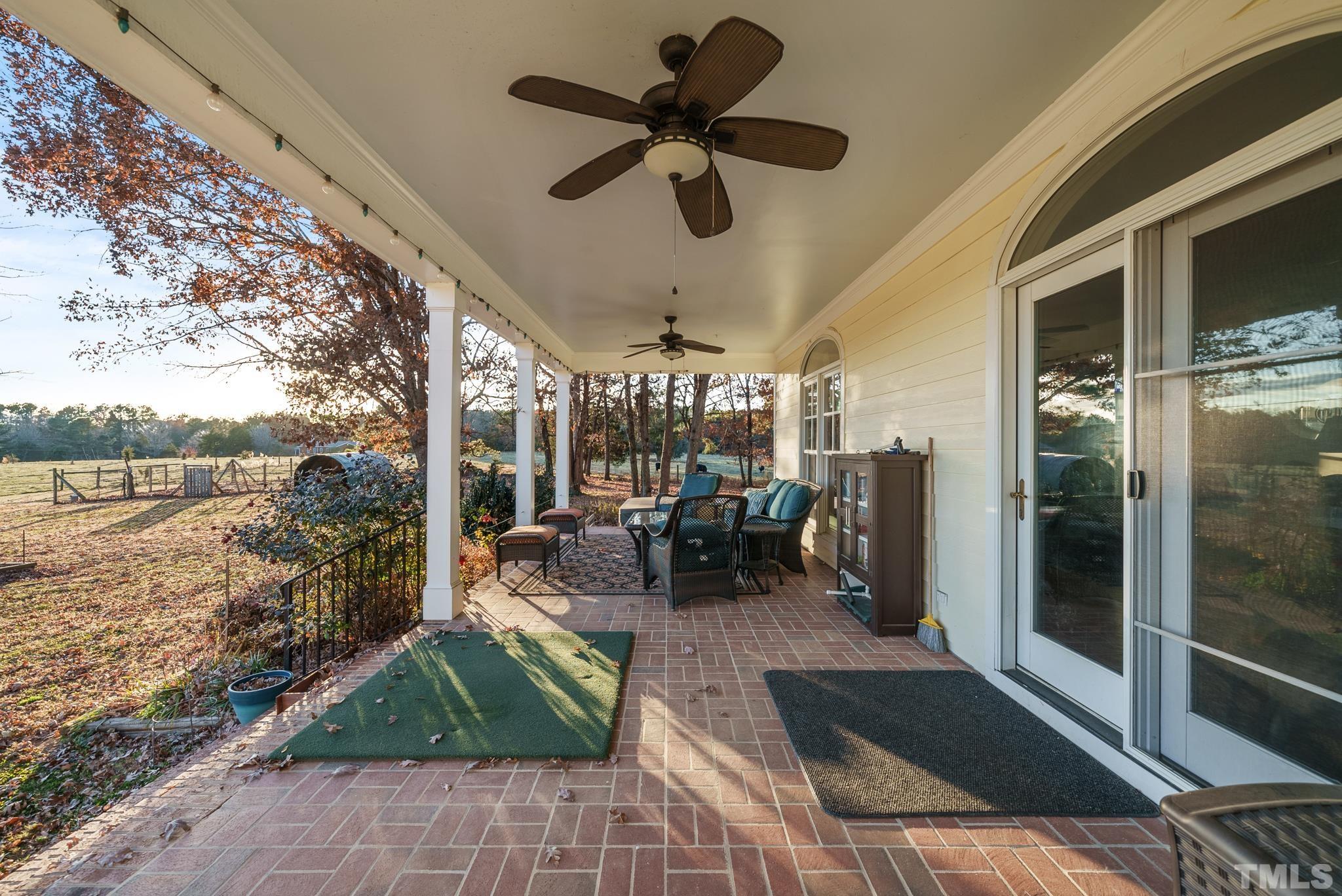 1616 Carl Durham Road Chapel Hill, NC 27516 - Photo 47 of 56 a view of a porch with dining table and chairs