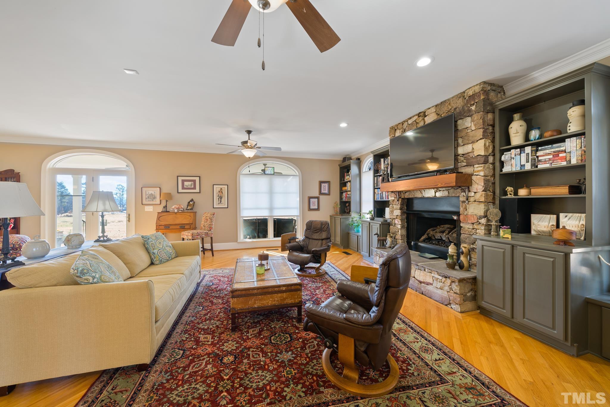 1616 Carl Durham Road Chapel Hill, NC 27516 - Photo 5 of 56 a living room with fireplace furniture and a rug