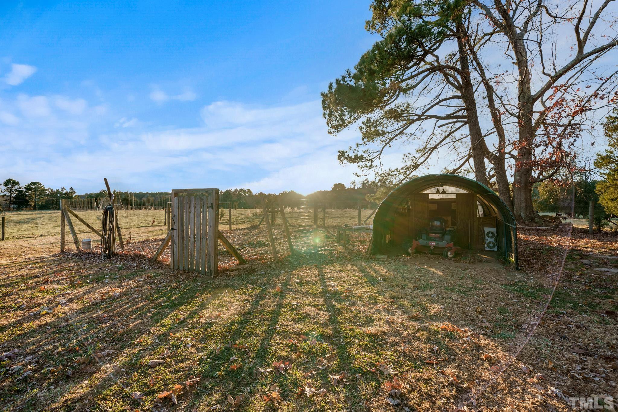 1616 Carl Durham Road Chapel Hill, NC 27516 - Photo 53 of 56 a view of a lake with a yard