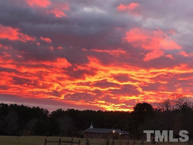 1616 Carl Durham Road Chapel Hill, NC 27516 - Photo 56 of 56 a view of a city with sunset
