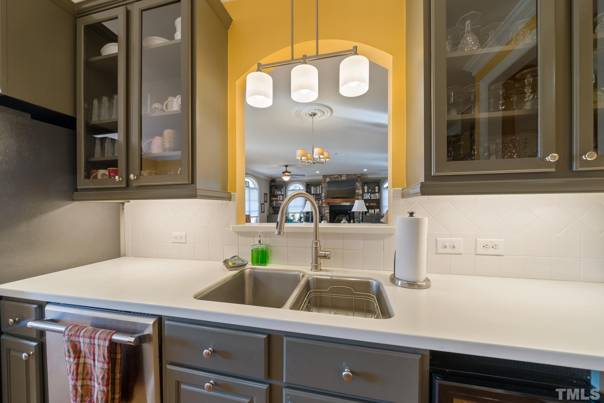 1616 Carl Durham Road Chapel Hill, NC 27516 - Photo 8 of 56 a kitchen with a sink and a mirror