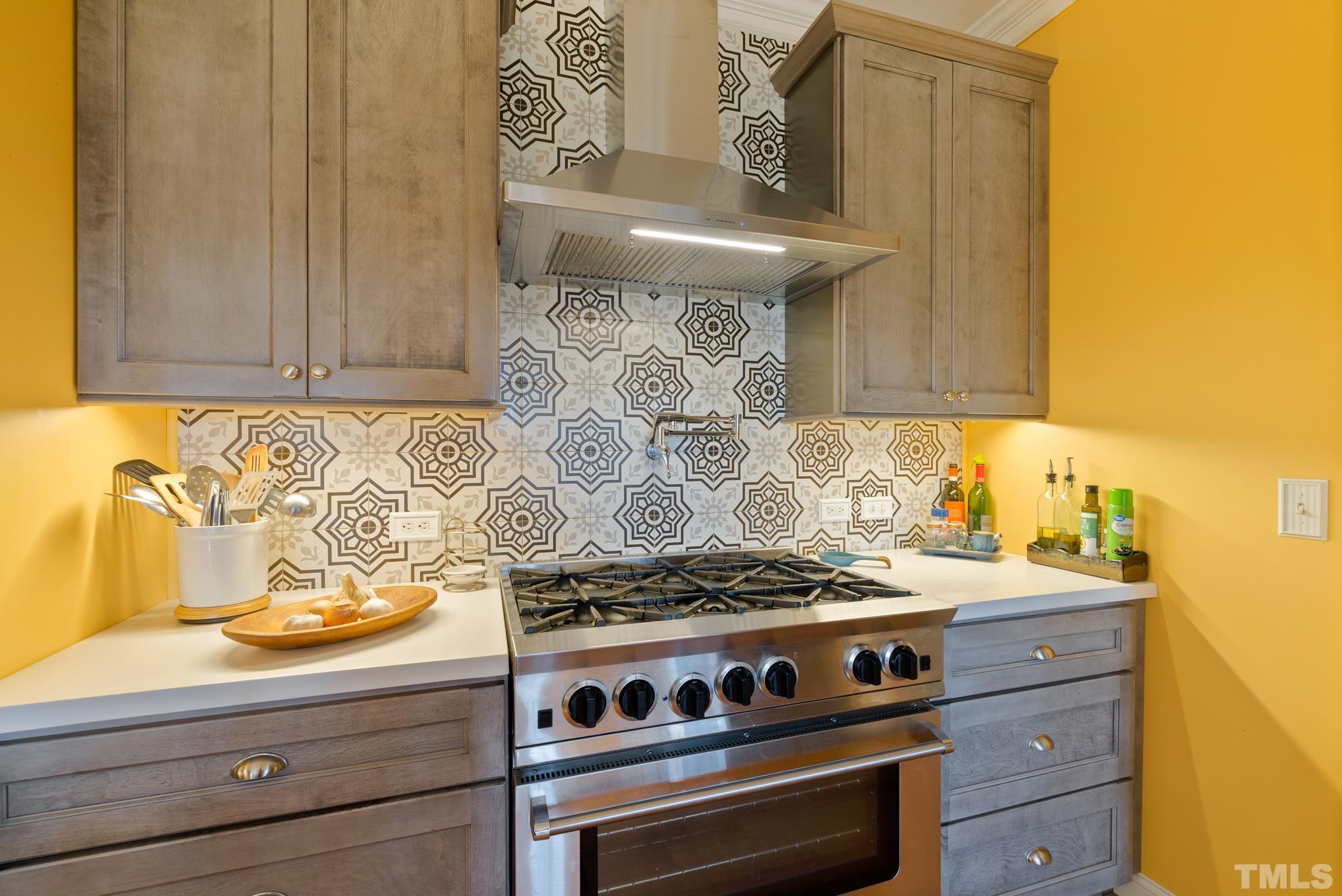 1616 Carl Durham Road Chapel Hill, NC 27516 - Photo 10 of 56 a stove top oven sitting inside of a kitchen