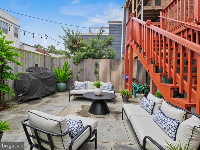 a view of building with yard and staircase
