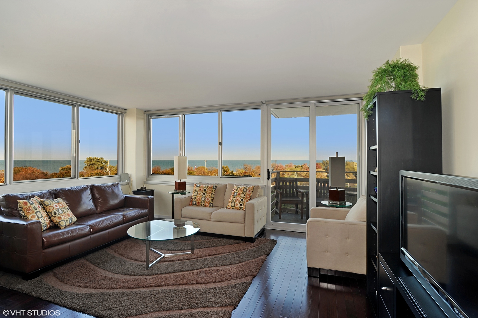 5601 North Sheridan Road, Unit 7A Chicago, IL 60660 - Photo 2 of 15 a living room with furniture and a large window