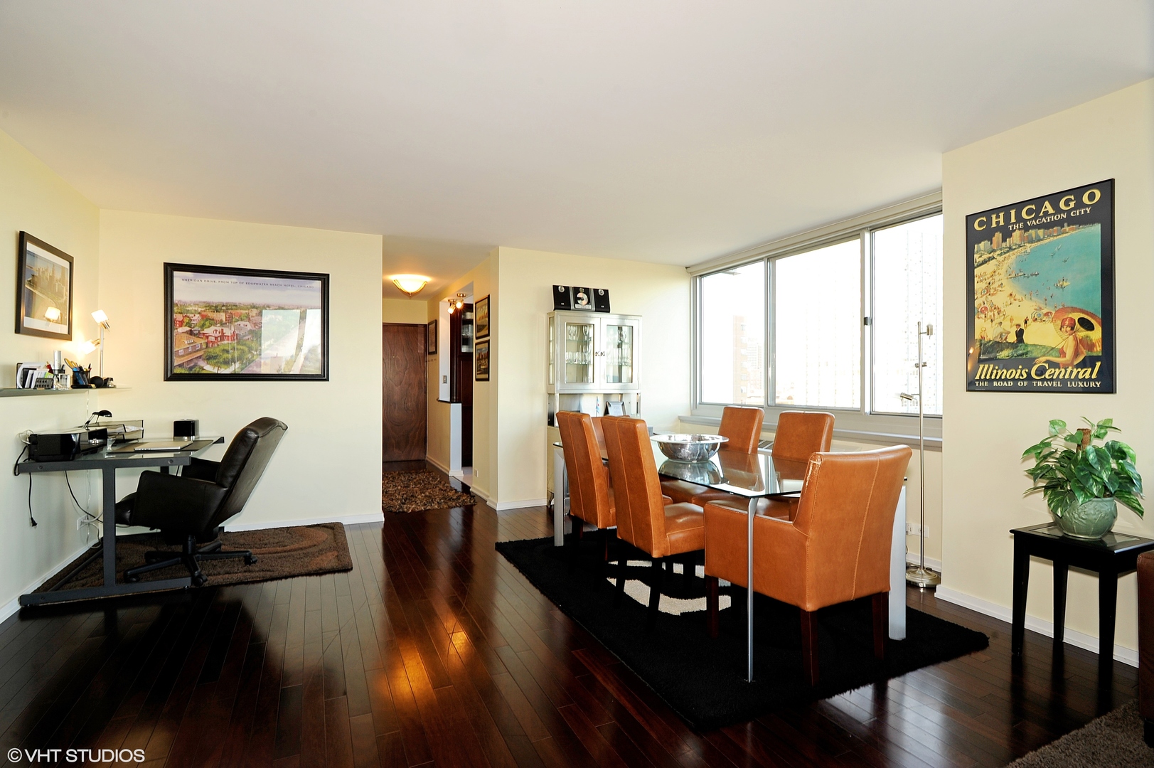 5601 North Sheridan Road, Unit 7A Chicago, IL 60660 - Photo 8 of 15 a view of a dining room with furniture window and wooden floor