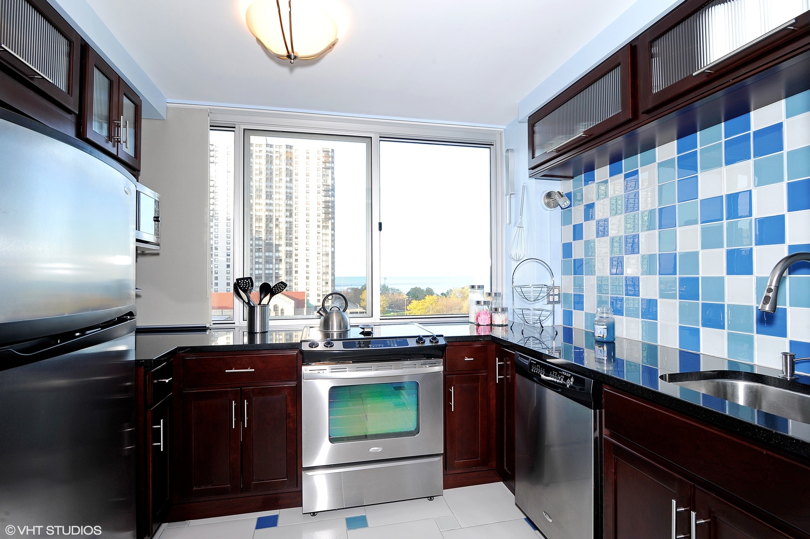5601 North Sheridan Road, Unit 7A Chicago, IL 60660 - Photo 9 of 15 a kitchen with a sink stove and cabinets