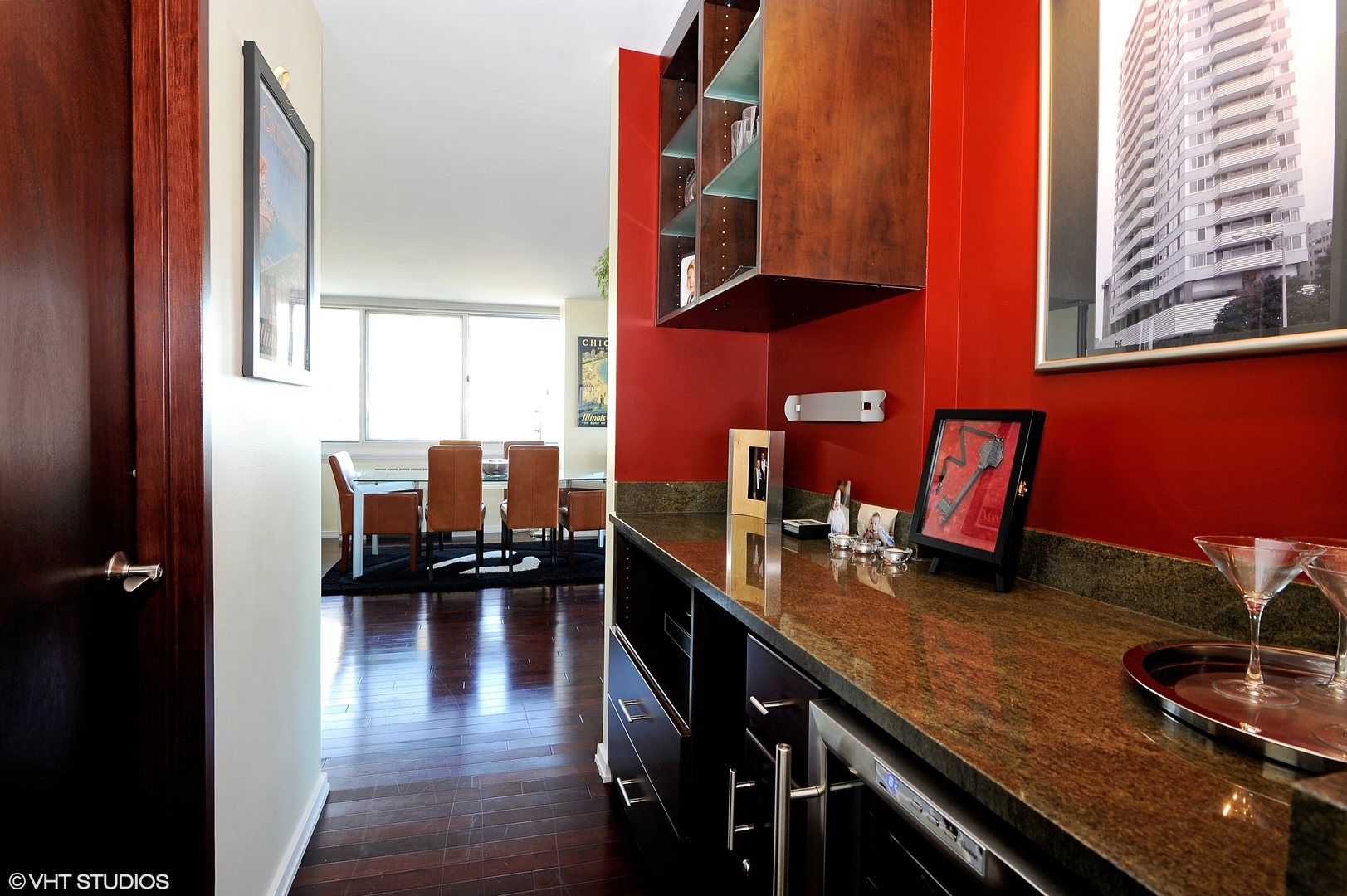 5601 North Sheridan Road, Unit 7A Chicago, IL 60660 - Photo 10 of 15 a kitchen with a table chairs and a stove