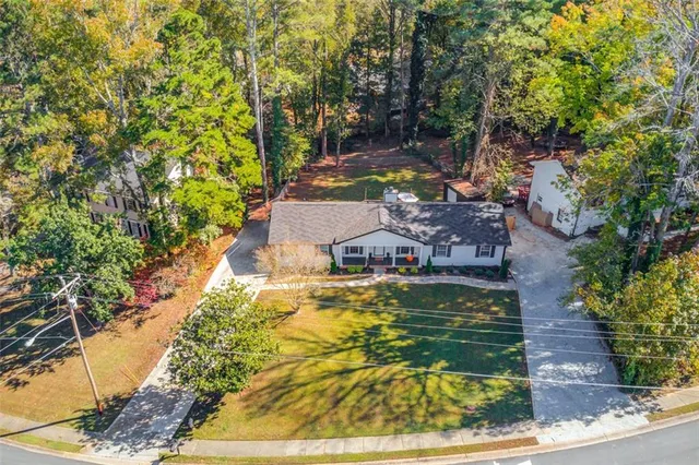 a swimming pool with trees in the background