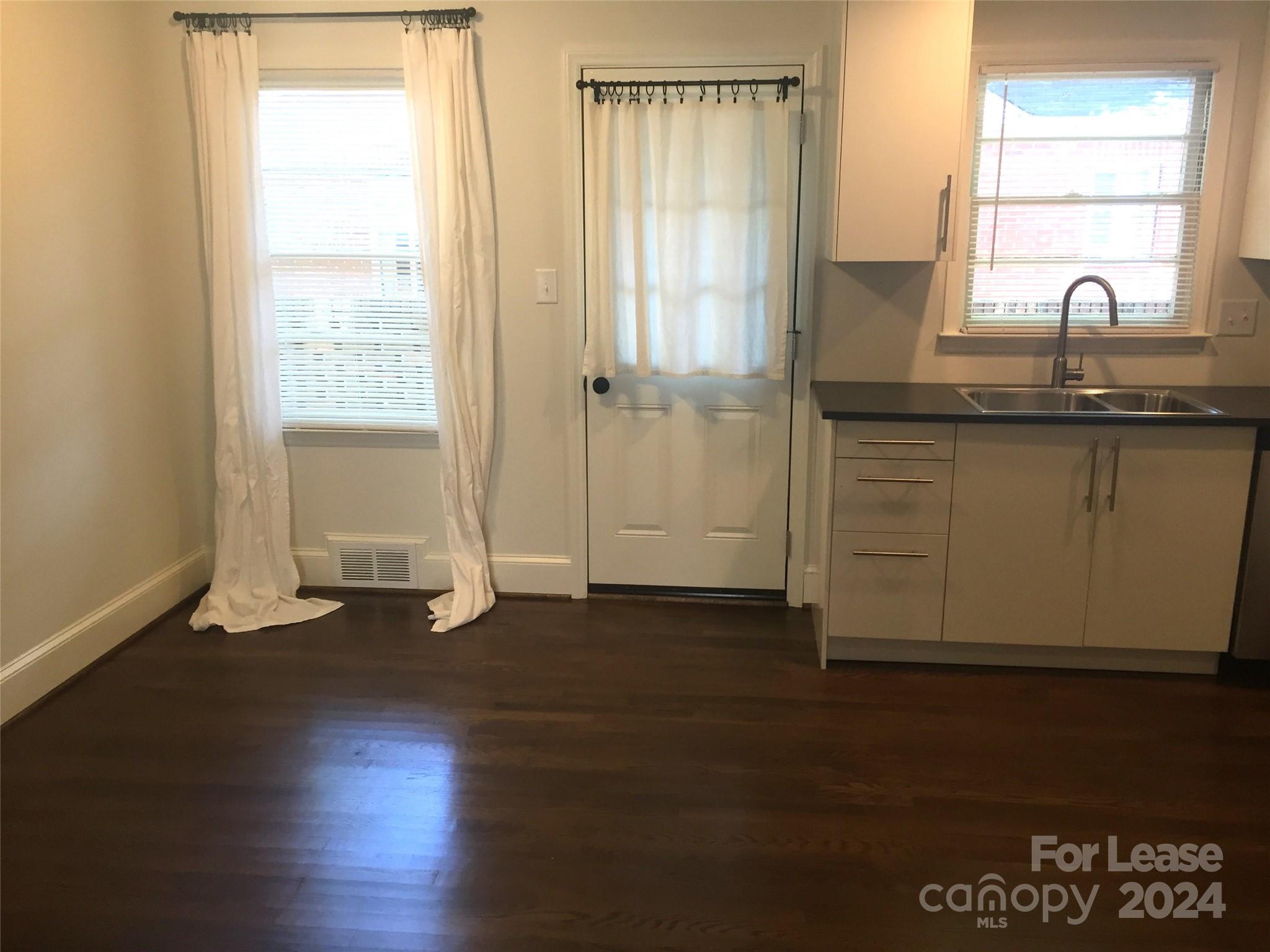 1824 Club Road Charlotte, NC 28205 - Photo 5 of 11 a view of a kitchen with wooden floor and a window