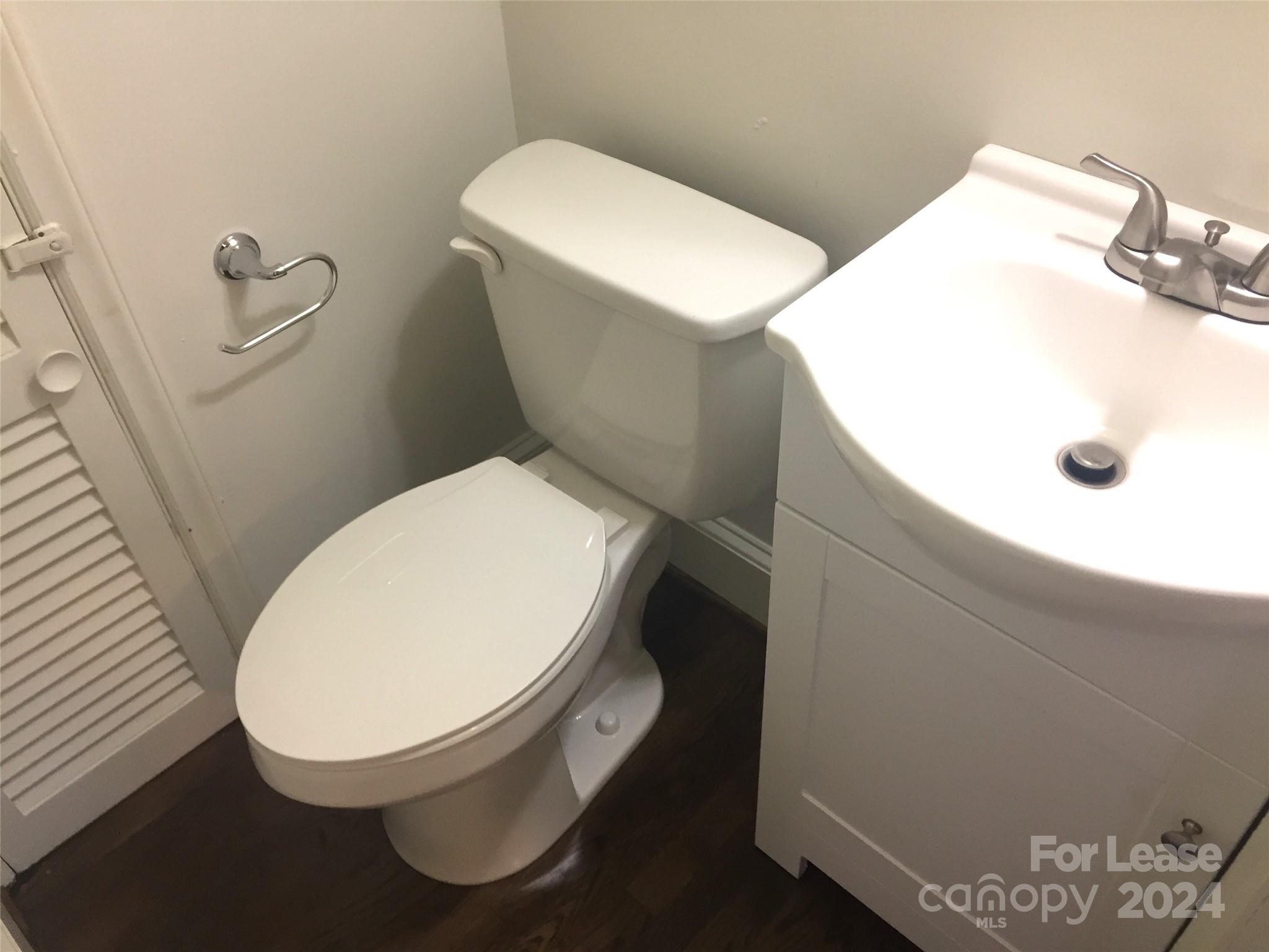 1824 Club Road Charlotte, NC 28205 - Photo 8 of 11 a bathroom with a toilet and a sink