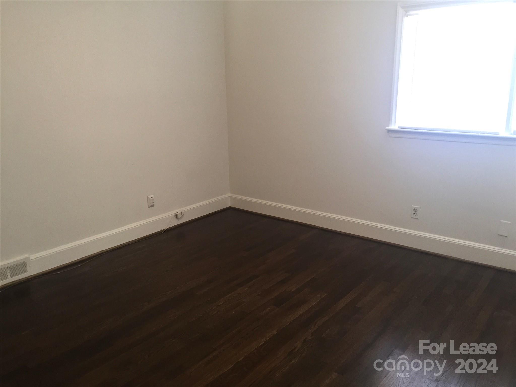 1824 Club Road Charlotte, NC 28205 - Photo 9 of 11 a view of a small space with wooden floor and a window