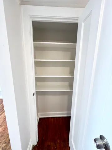 a bathroom with a toilet a sink and a mirror