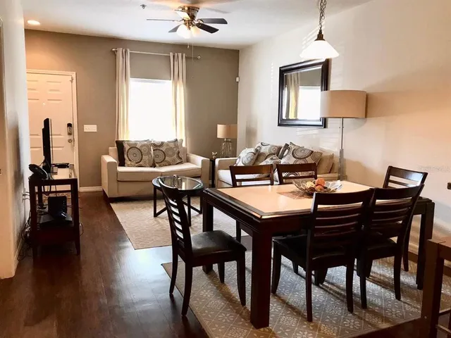 a view of a dining room with furniture and wooden floor