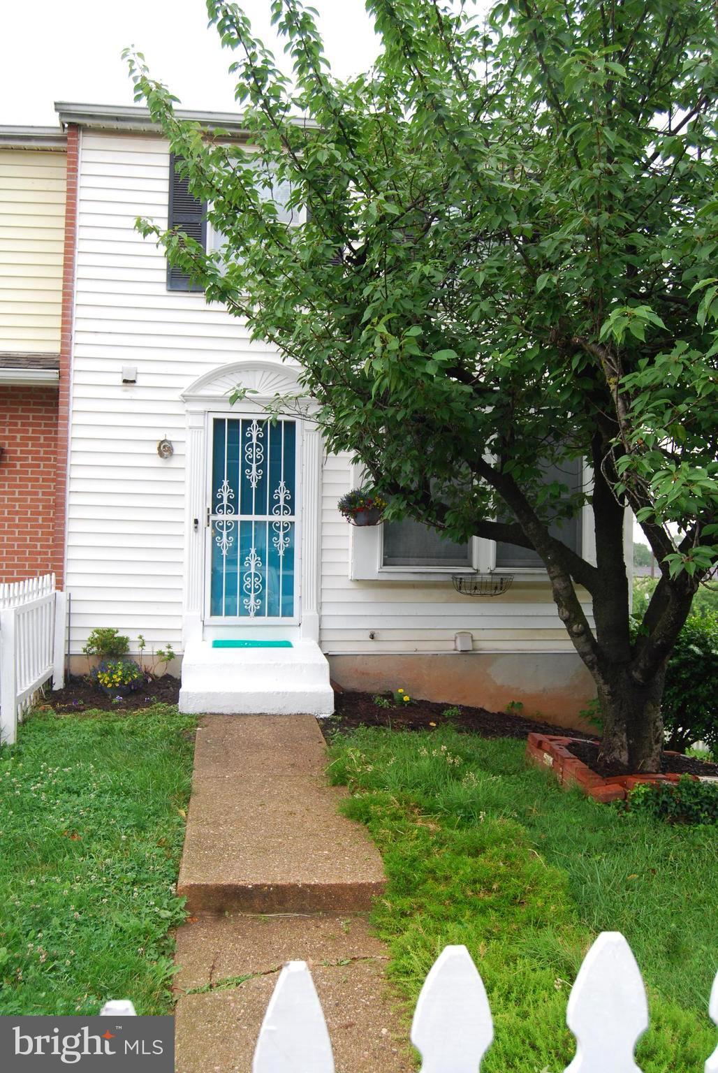 2400 Ridgely Street Baltimore, MD 21230 - Photo 1 of 20 a front view of house with yard and green space