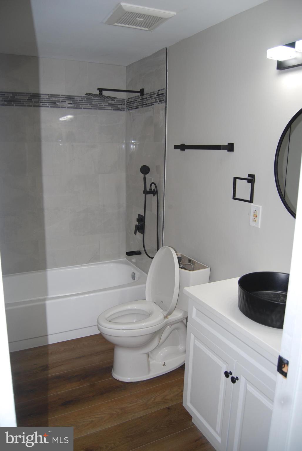 2400 Ridgely Street Baltimore, MD 21230 - Photo 9 of 20 a bathroom with a toilet and a shower