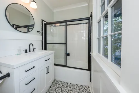 a bathroom with a sink and a mirror