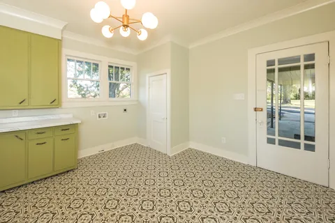 a view of a kitchen with a sink cabinet and a window