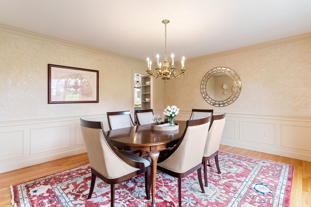 19 Buttonwood Drive Andover, MA 01810 - Photo 11 of 42 a dining room with furniture a rug and wooden floor