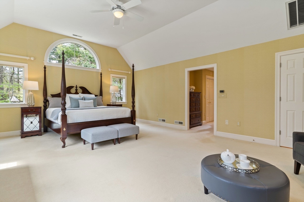 19 Buttonwood Drive Andover, MA 01810 - Photo 17 of 42 a spacious bedroom with a bed and a large window