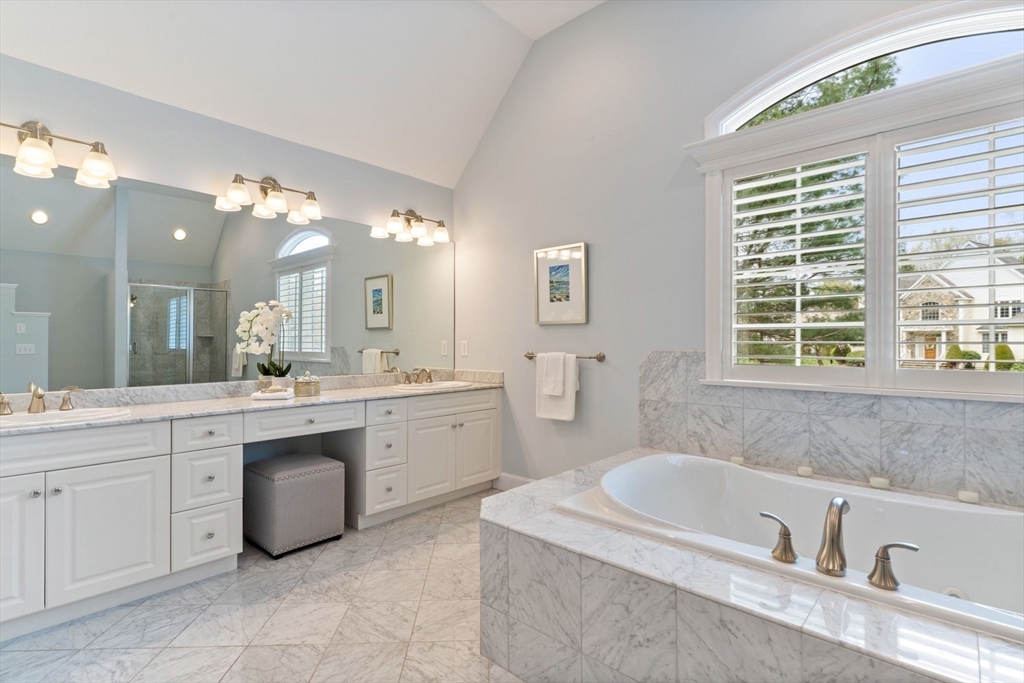19 Buttonwood Drive Andover, MA 01810 - Photo 20 of 42 a bathroom with a granite countertop sink mirror and a bathtub