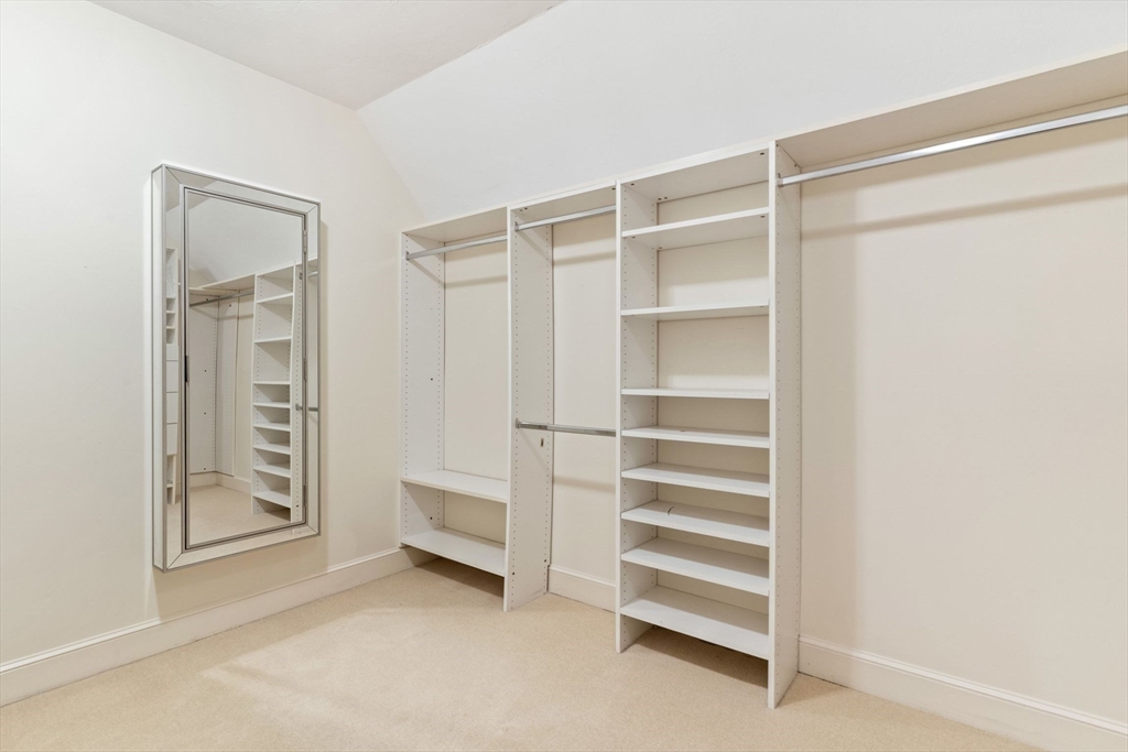 19 Buttonwood Drive Andover, MA 01810 - Photo 22 of 42 a view of walk in closet with empty racks