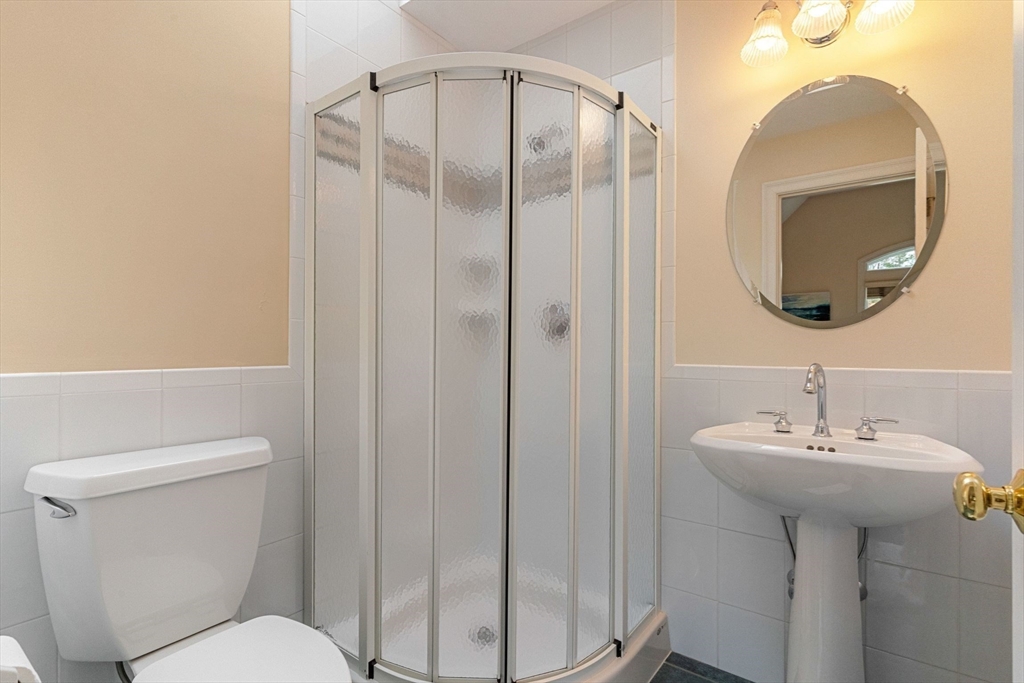 19 Buttonwood Drive Andover, MA 01810 - Photo 24 of 42 a bathroom with a sink toilet and a mirror