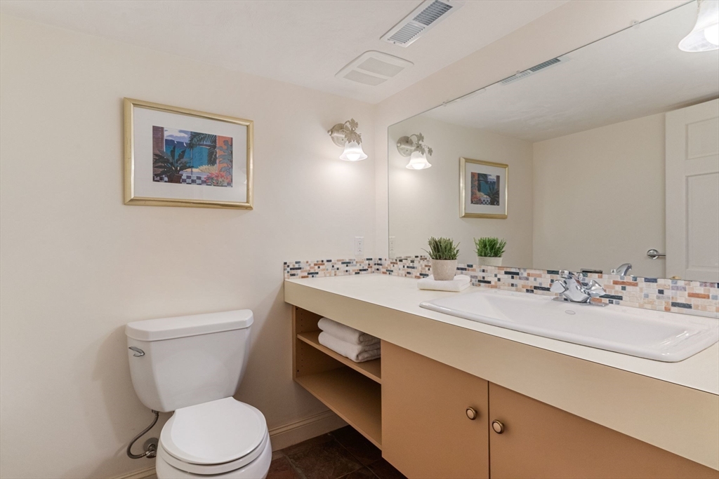19 Buttonwood Drive Andover, MA 01810 - Photo 35 of 42 a bathroom with a toilet sink and mirror