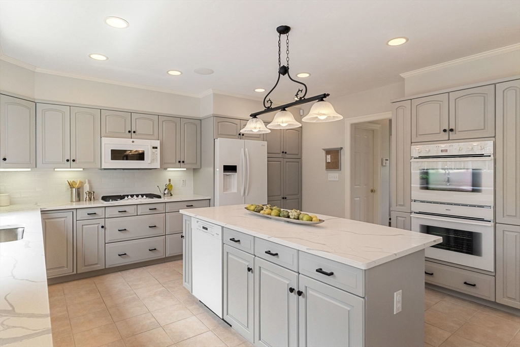 19 Buttonwood Drive Andover, MA 01810 - Photo 5 of 42 a kitchen with a sink stove and refrigerator