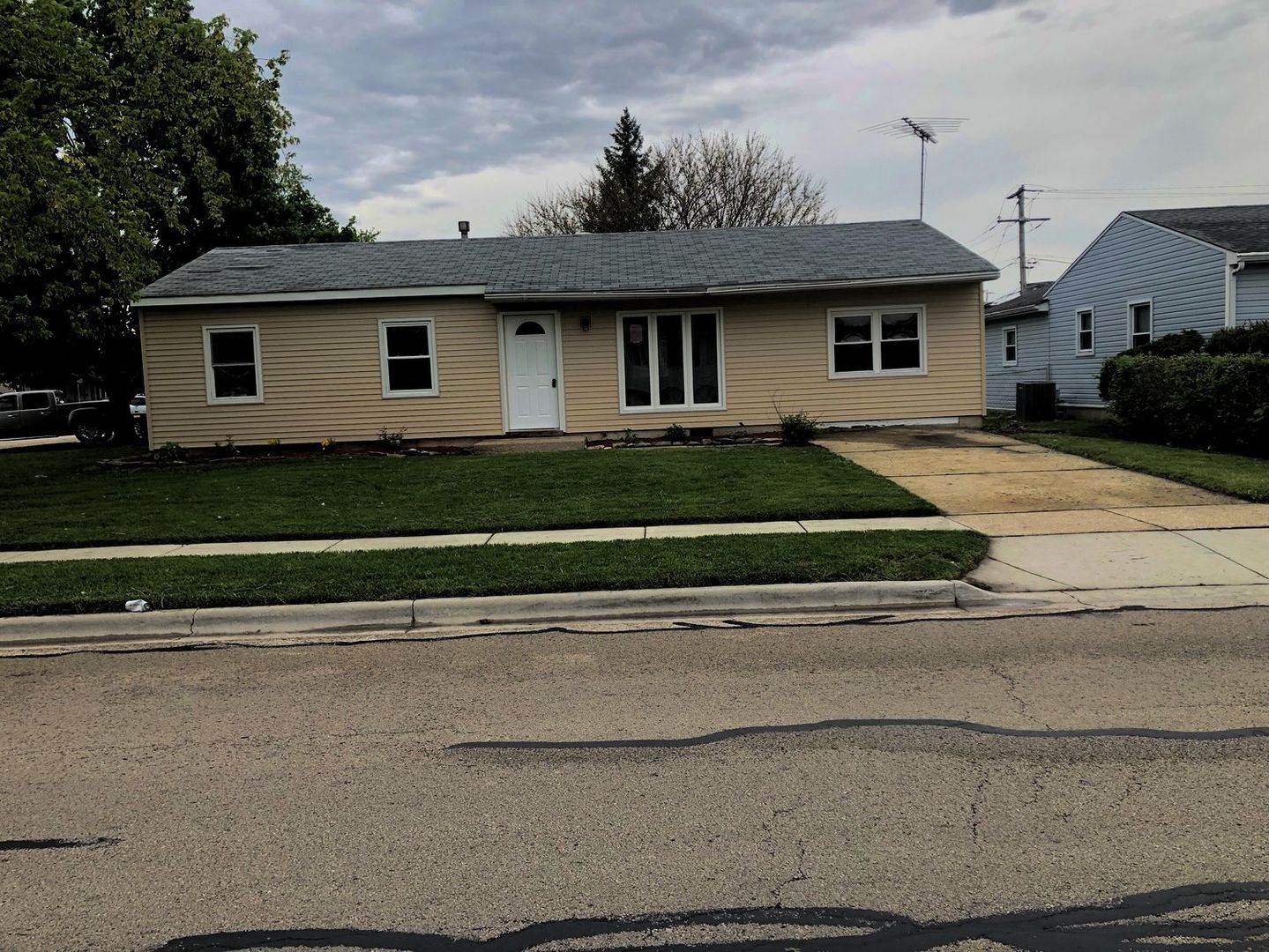110 McKool Avenue Romeoville, IL 60446 - Photo 1 of 17 a front view of a house with a garden