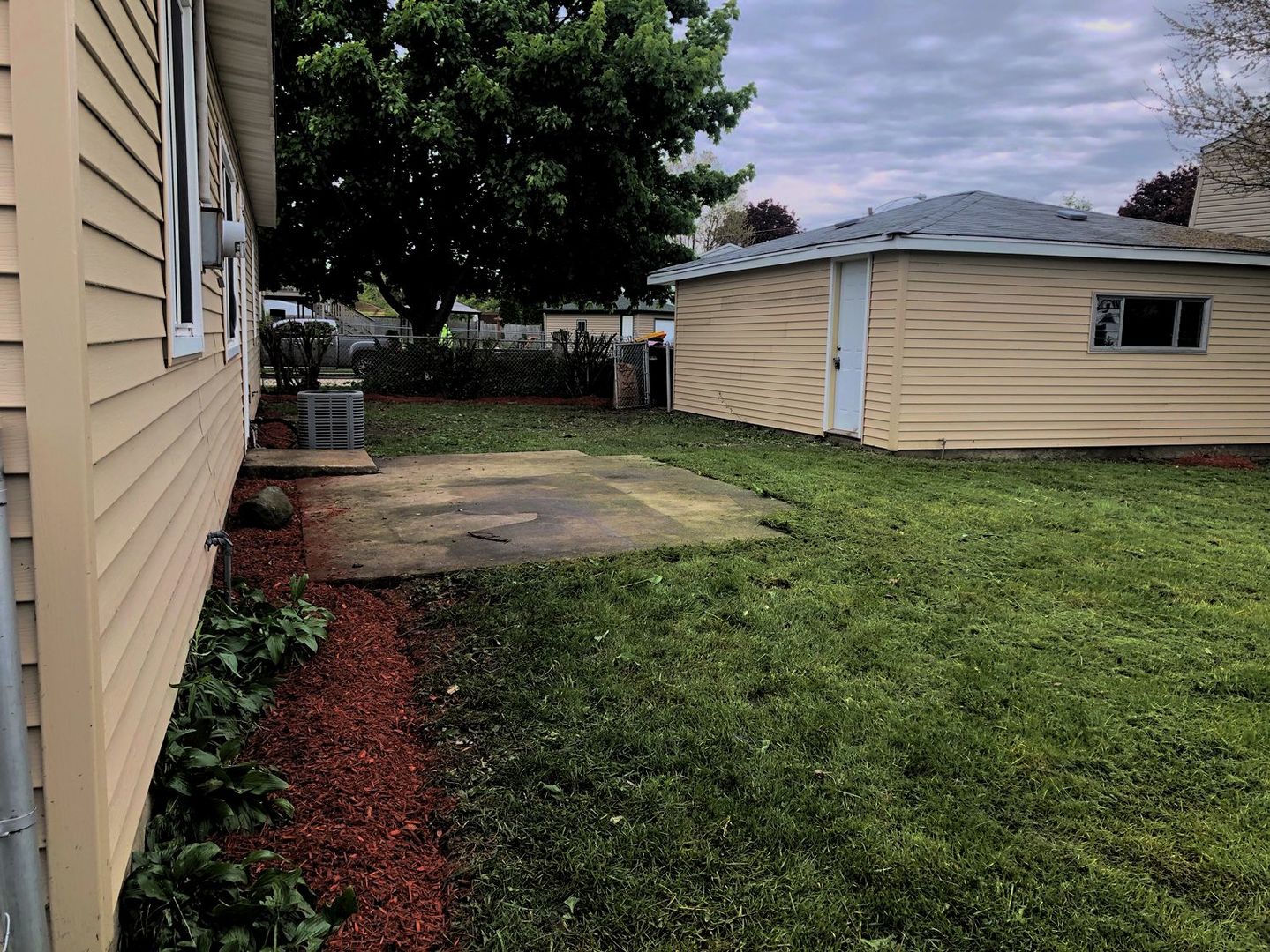 110 McKool Avenue Romeoville, IL 60446 - Photo 16 of 17 a backyard of a house with lots of green space