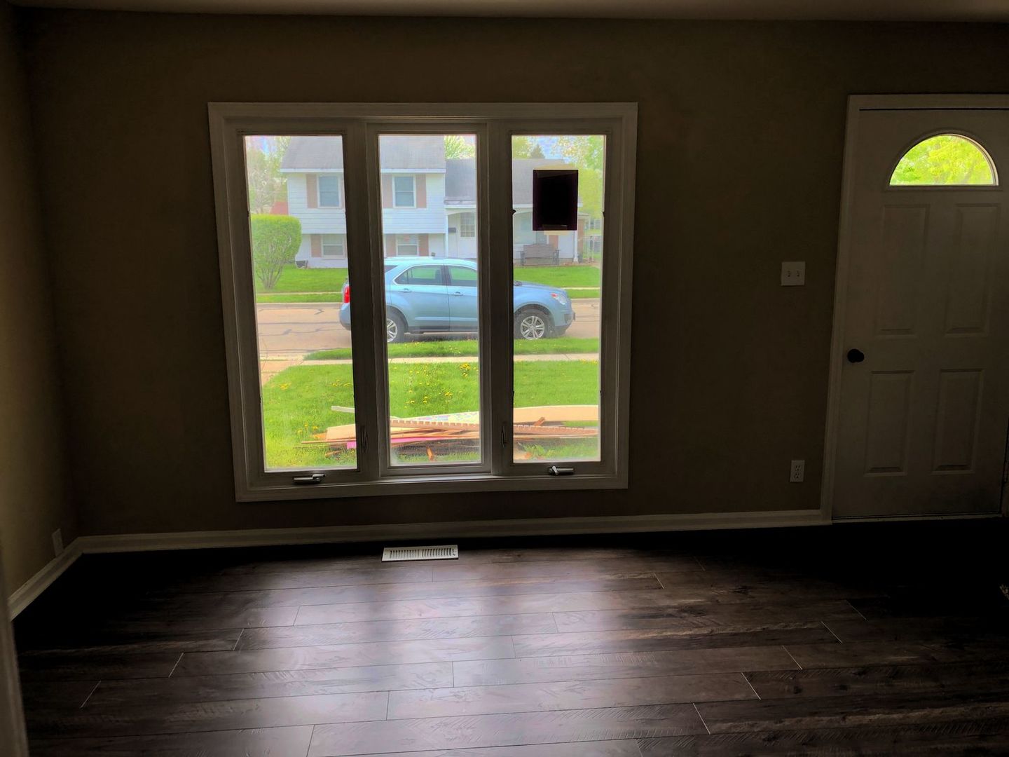 110 McKool Avenue Romeoville, IL 60446 - Photo 3 of 17 a view of empty room with wooden floor and fan